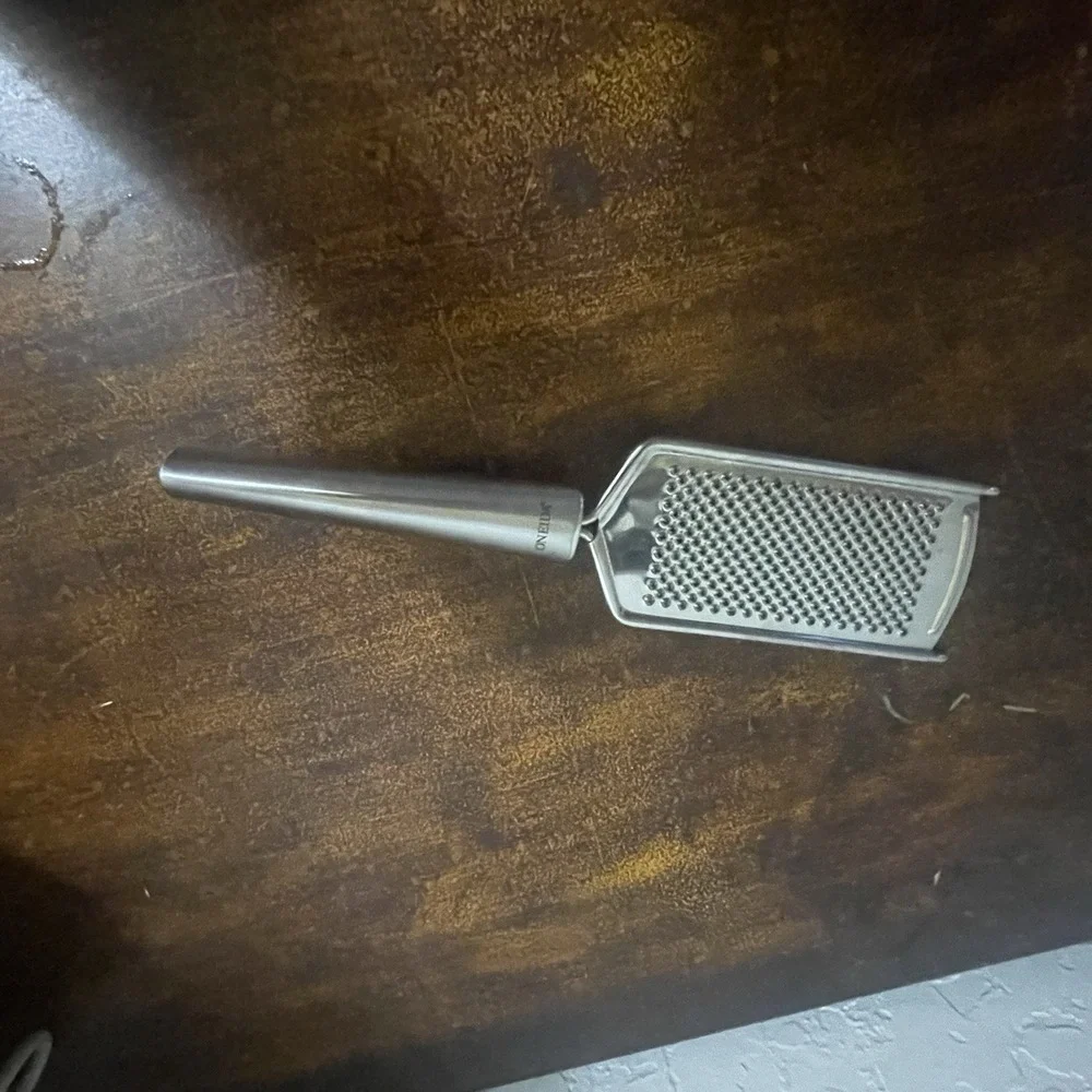 Oneida Stainless Steel Hand Grater/ Zester with Hand Grip and Pot Hook.